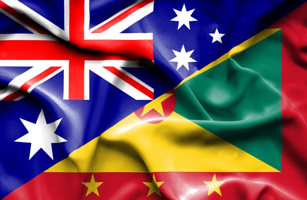 Wapperende vlag van Guernsey en Australië — Stockfoto