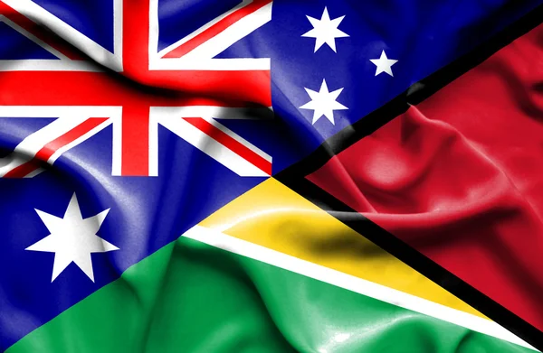 Waving flag of Guyana and Australia — Stock Photo, Image