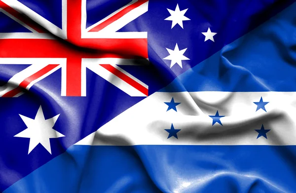 Waving flag of Honduras and Australia — Stock Photo, Image