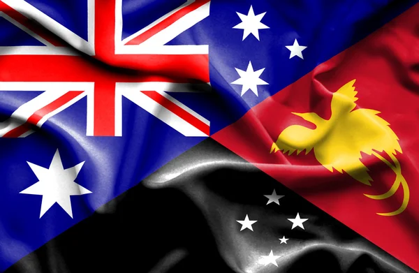 Waving flag of Papua New Guinea and Australia — Stock Photo, Image