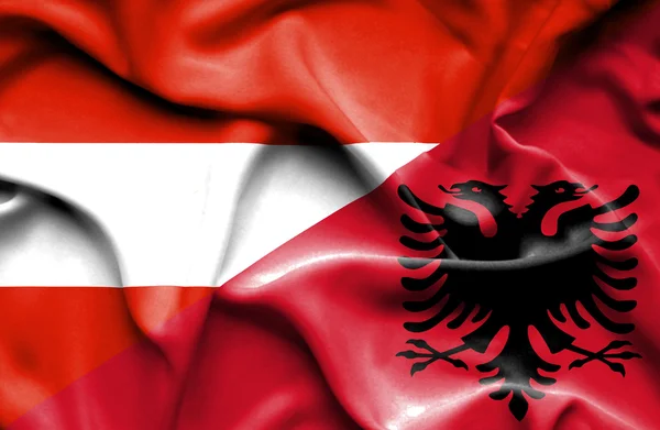 Vlající vlajka Albánie a Rakouska — Stock fotografie