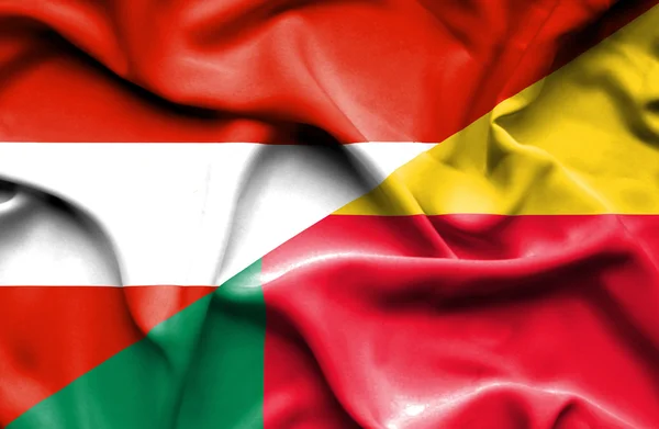 Waving flag of Benin and Austria — Stock Photo, Image