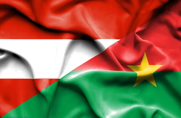 Wapperende vlag van Burkina Faso en Oostenrijk — Stockfoto