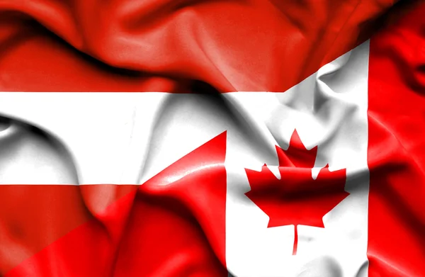 Waving flag of Canada and Austria — Stock Photo, Image