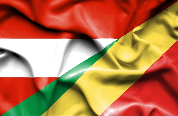 Mávání vlajkou Konžské republiky a Rakouska — Stock fotografie