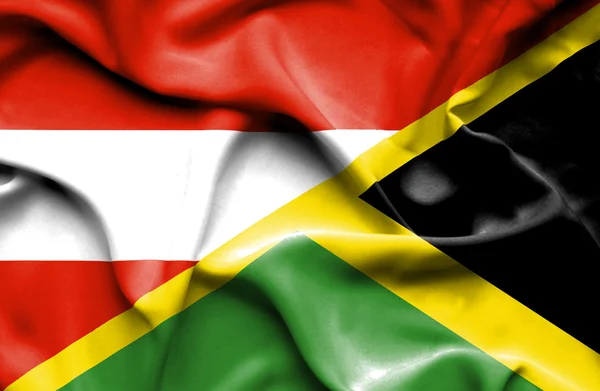 Vlající vlajka Jamajky a Rakouska — Stock fotografie