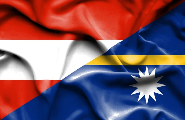 Flagge von Nauru und Österreich schwenken — Stockfoto