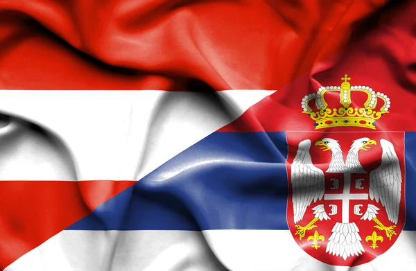 Waving flag of Serbia and Austria — Stock Photo, Image