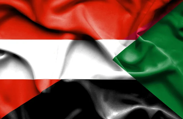 Waving flag of Sudan and Austria — Stock Photo, Image