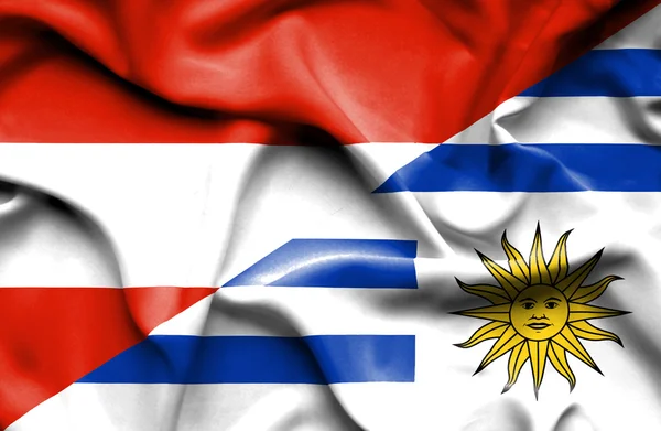 Waving flag of Uruguay and Austria — Stock Photo, Image