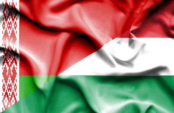 Waving flag of Hungary and Belarus — Stock Photo, Image