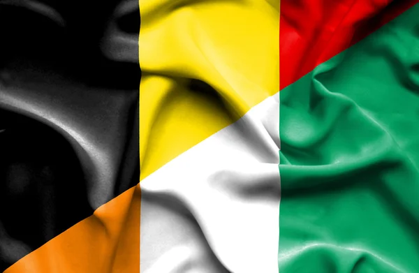 コートジボワールとベルギーの旗を振ってください。 — ストック写真