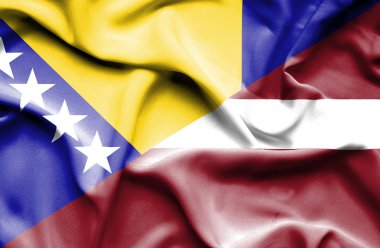 Letonya ve Bosna-Hersek bayrağı sallayarak