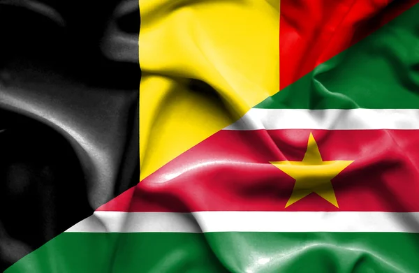 Waving flag of Suriname and Belgium — Stock Photo, Image