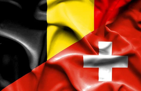 Vlající vlajka Švýcarska a Belgie — Stock fotografie