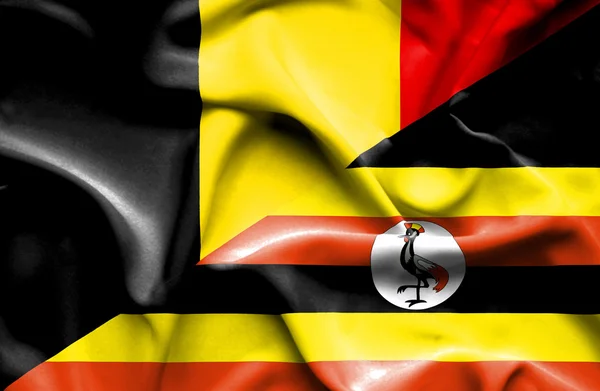 Vlající vlajka Ugandy a Belgie — Stock fotografie
