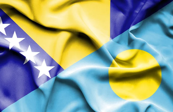 Flagge von Palau und Bosnien und Herzegowina schwenken — Stockfoto