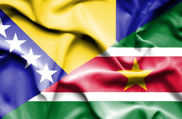 Waving flag of Suriname and Bosnia and Herzegovina — Stock Photo, Image