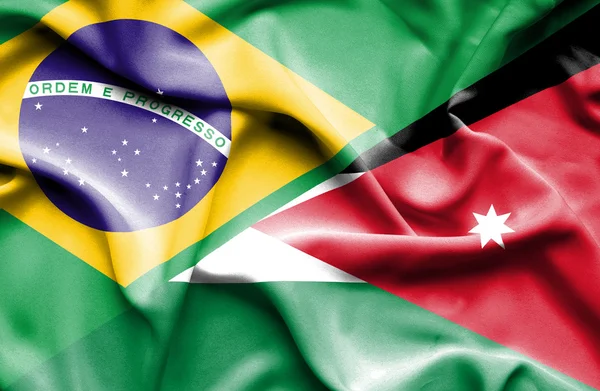 Mávání vlajkou Jordan a Brazílie — Stock fotografie