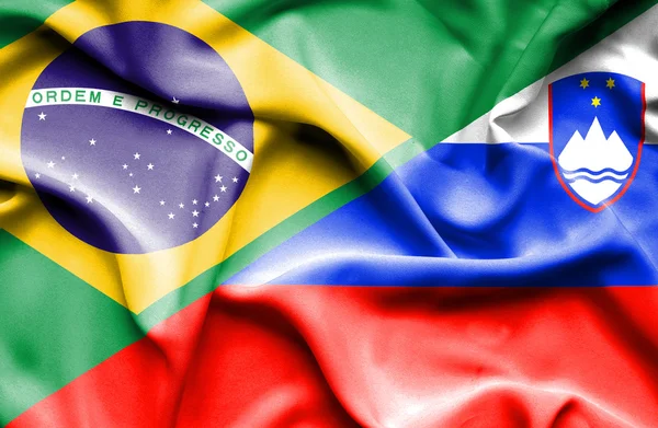 Waving flag of Slovenia and Brazil — Stock Photo, Image