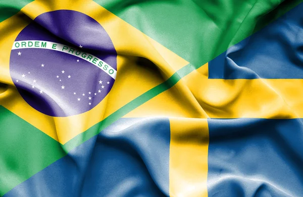 Waving flag of Sweden and Brazil — Stock Photo, Image