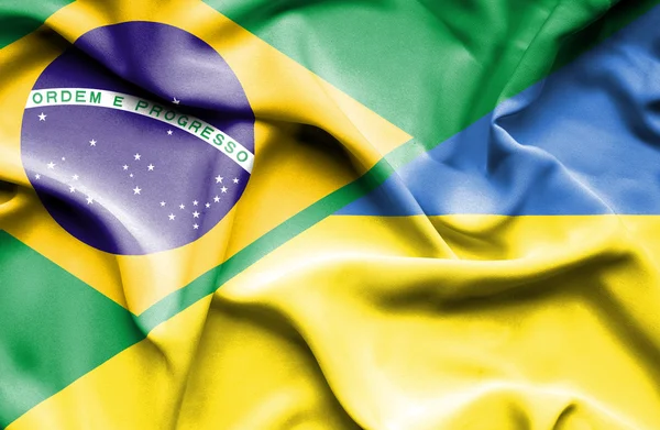 Waving flag of Ukraine and Brazil — Stock Photo, Image