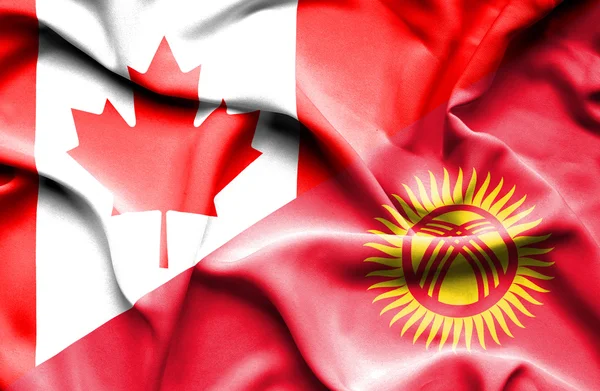 Waving flag of Kyrgyzstan and Canada — Stock Photo, Image