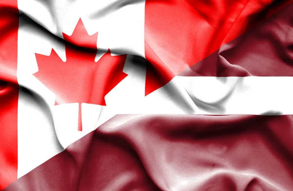 Bandiera sventolante di Lettonia e Canada — Foto Stock