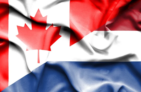 Waving flag of Netherlands and Canada — Stock Photo, Image