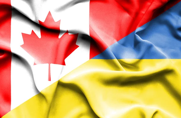 Waving flag of Ukraine and Canada — Stock Photo, Image