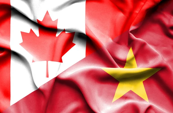 Waving flag of Vietnam and Canada — Stock Photo, Image