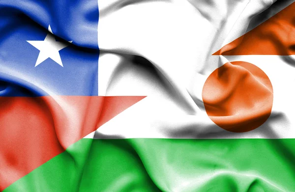 Waving flag of Niger and Chile — Stock Photo, Image