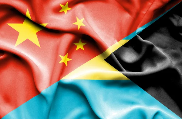 Fahne aus Bahamas und China schwenken — Stockfoto
