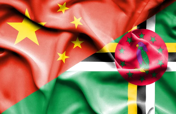 Waving flag of Dominica and China — Stock Photo, Image