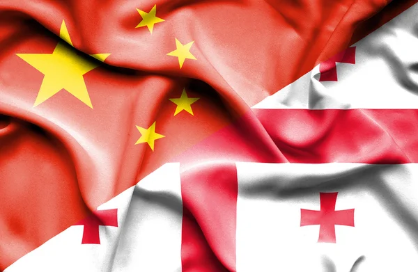 Flagge von Georgien und China schwenken — Stockfoto