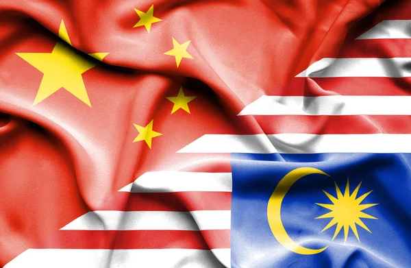 Waving flag of Malaysia and China — Stock Photo, Image