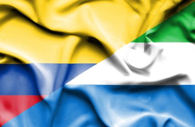 Sierra Leone ve Columbia bayrağı sallayarak