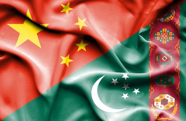 Wapperende vlag van Turkmenistan en China — Stockfoto