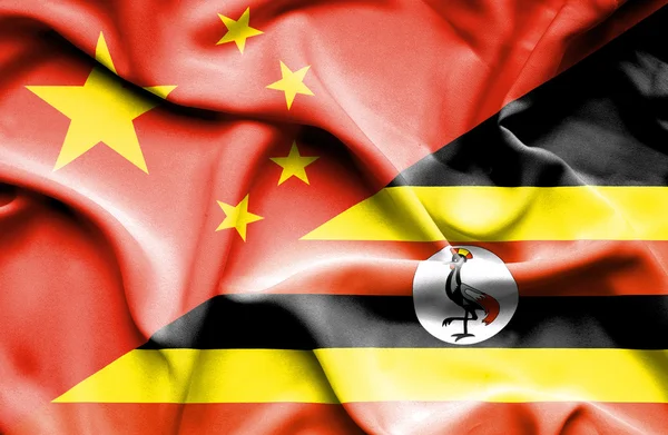 Bandeira acenando de Uganda e China — Fotografia de Stock