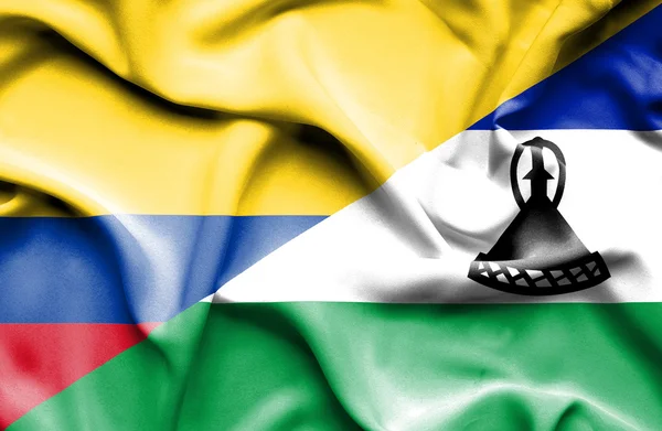 Lesotho och Columbia viftande flagga — Stockfoto