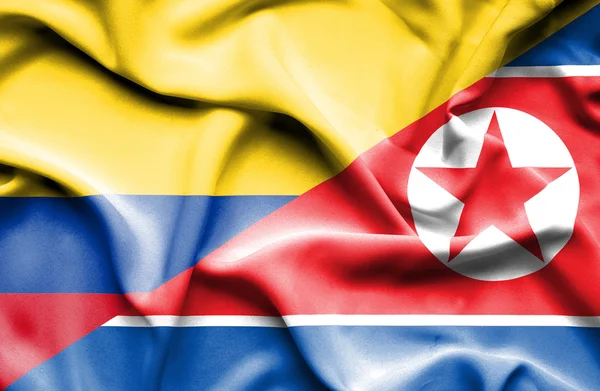Flagge Nordkoreas und Kolumbiens schwenken — Stockfoto