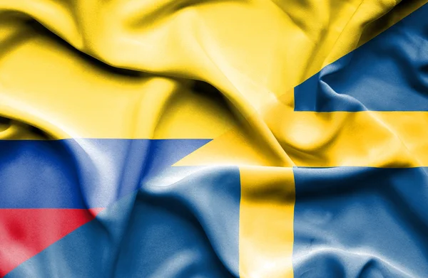 Waving flag of Sweden and Columbia — Stock Photo, Image