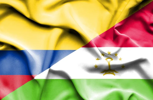 塔吉克斯坦和哥伦比亚那飘扬的旗帜 — 图库照片