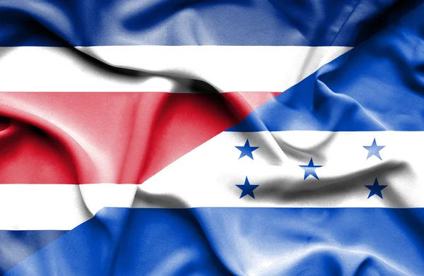 Sventolando bandiera di Honduras e Costa Rica — Foto Stock