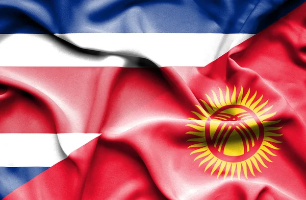 Waving flag of Kyrgyzstan and Costa Rica — Stock Photo, Image