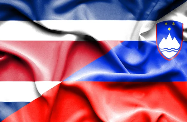 Waving flag of Slovenia and Costa Rica — Stock Photo, Image