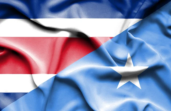 Wapperende vlag van Somalië en Costa Rica — Stockfoto