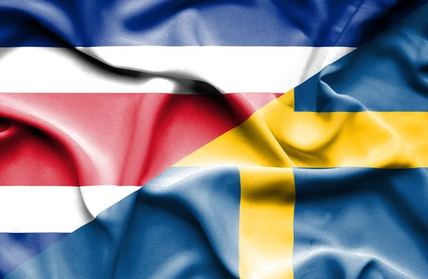 Waving flag of Sweden and Costa Rica — Stock Photo, Image