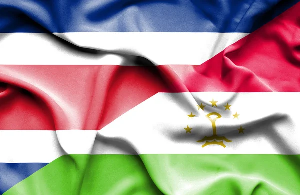 Flagge von Tadschikistan und Costa Rica schwenken — Stockfoto