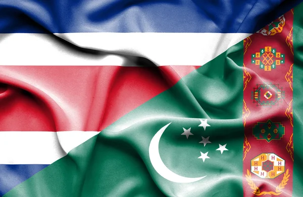 Waving flag of Turkmenistan and Costa Rica — Stock Photo, Image